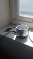 The mini speaker with USB charger attached.
