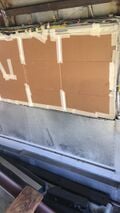 Step 8a. Cover windows in preparation to remove wall panels with angle grinder