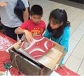 Kids enjoy playing with the salt as it vibrates around