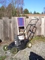 Solar-charged lawnmower The basic idea is to convert an older non-working gas mower into an electric-powered mower by replacing the gas engine with an electric motor that runs from a 12-volt battery.