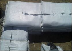 Figure 8 Barbed wire between layers (Photo courtesy of T. Sturgis)