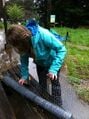 Fig 3: Morgan unravels chicken wire to attach to the test surface.