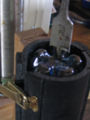 Fig 4. Drilling the hole in the base of bottle.