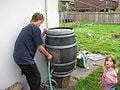 Figure 1: Rinsing the barrel to clean out all debris, old wine, and anything else to get it as clean as can be!