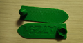 "First PLA Prototype" This first PLA prototype was created with the intention of trying to 3D print a tag. The team tried to replicate all parts desired of "Streamline Tag", including the post, collar, and the embedded lettering. The shape and size of the tag needed to be adjusted, as well as the lettering itself.