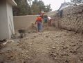 Fig 4: When there weren't large rocks in the way, shovels were used to take out the dirt from the foundation of the oven and it was piled along side of it.